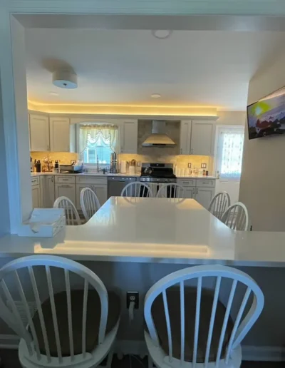 After renovation photo of the kitchen, showcasing upgraded finishes, improved structure, and refined craftsmanship.