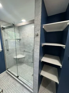 Detailed shower view featuring tilework, grout precision, and modern fixtures.