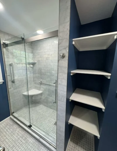 Detailed shower view featuring tilework, grout precision, and modern fixtures.