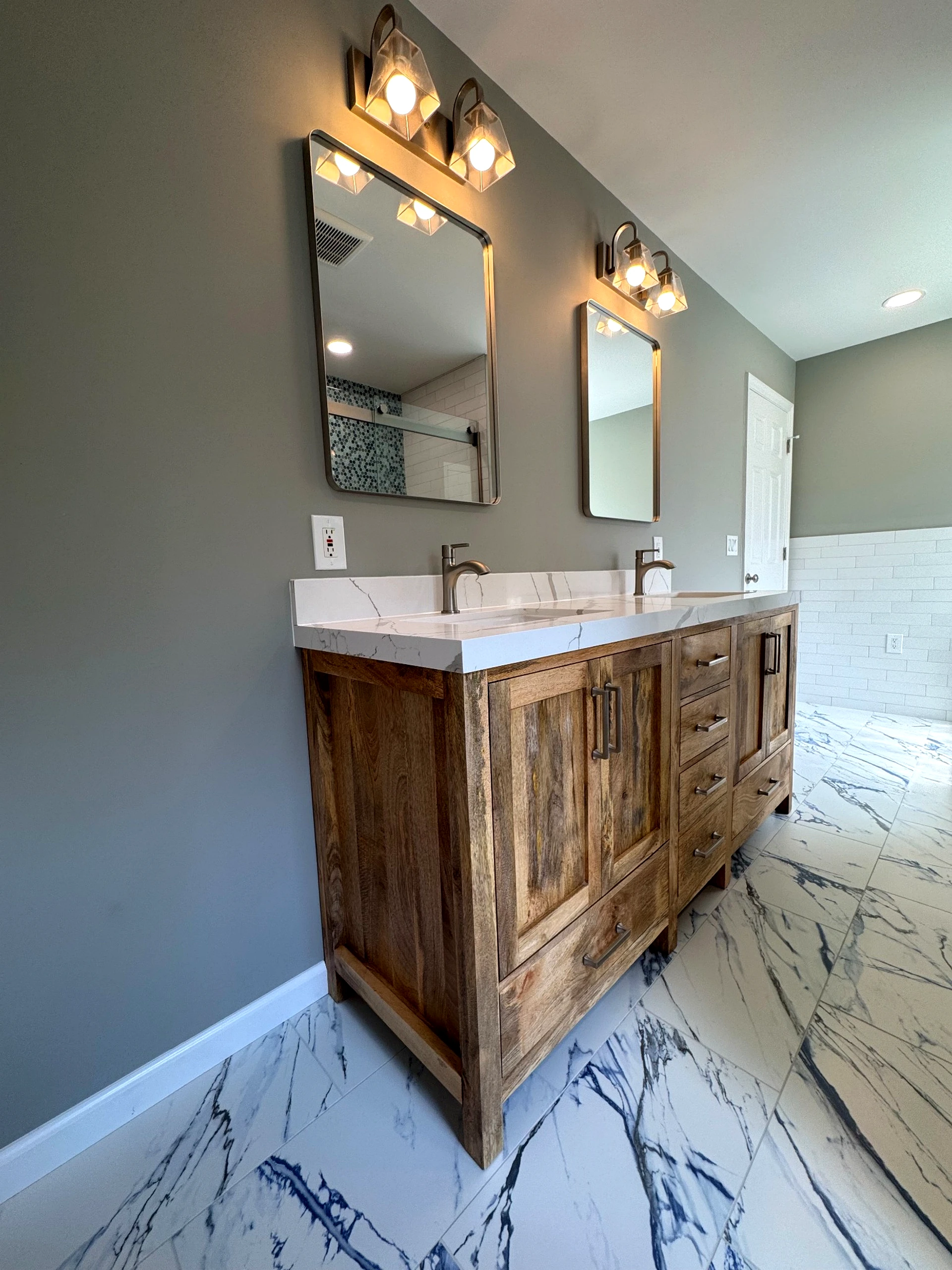 Before photo of the bathroom, capturing its original layout, materials, and condition prior to renovation.